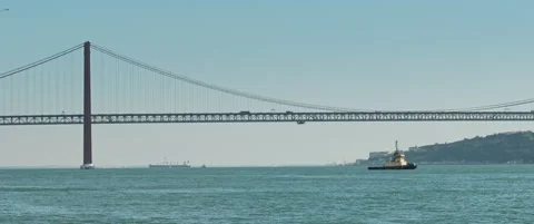 A small ship sailing under the bridge Stock Footage 151390946