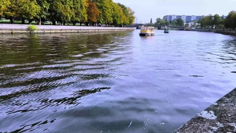 A small ship sails along the river in the city with tourists Stock Footage 252846721
