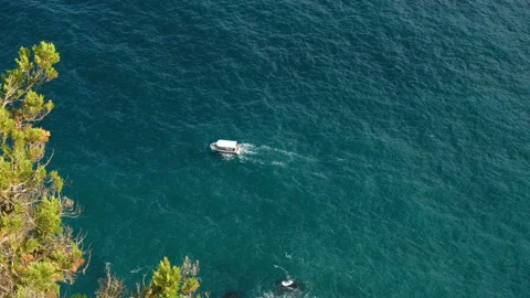 A small ship sails on the sea. Video stock 98095270