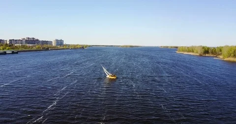 Small ship sails. Sunny landscape of the river in windy weather. Stock Footage 75051281