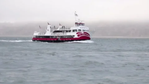 Small ship saling in between waves in San Francisco bay. Stock Footage 135798314