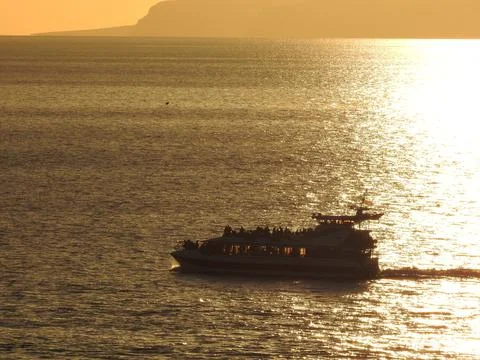 Small ship in sunset Stock Photos