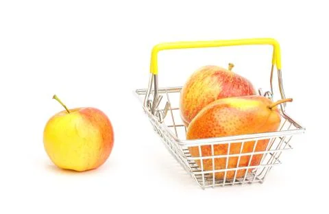 A small shopping basket with fruits, apples, pears on a white background. Stock Photos