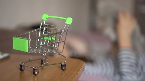A small shopping basket stands on the computer desk Video stock 152513126