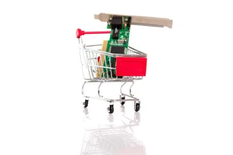 Small shopping cart with computer hardware, isolated over white Stock Photos