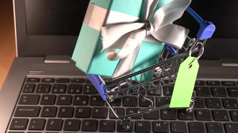 Small shopping cart with a gift inside and a green tag Stock Footage 159209844