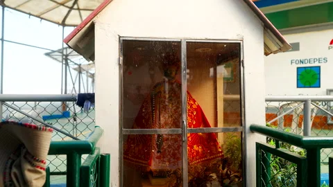 Small Shrine with Religious Statue Beside Paracas Harbor Walkway Vídeos de archivo 334344749