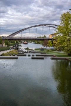 Small side river with steps and bridge Stock Photos