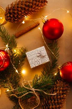 Small silver gift box with red christmas decoration Stock Photos