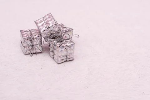Small silver gift boxes tied with rope on white Stock Photos