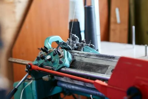 A small simple knitting machine with threads Stock Photos