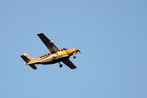 Small single engine aircraft flying Stock Photos