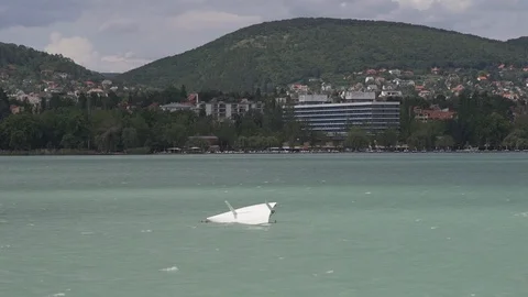 Small sinking boat, shot from a passing ship, stock video Vidéo 94499704