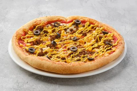 Small size pizza with minced beef meat, sweet corn and mustard sauce Stock Photos