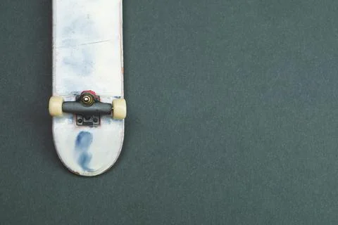 Small skateboard on color background. tiny skate for fingers. fingerboard clo Stock Photos