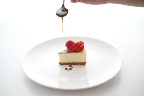 Small slice of cheesecake on a big plate Foto stock