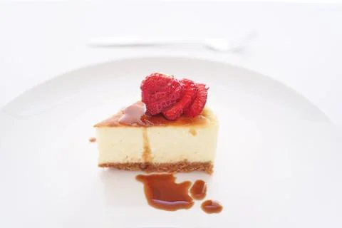 Small slice of cheesecake on a big plate Stock Photos