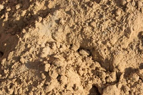 Small slides on the surface of the sand on the beach or in a sandbox Stock Photos