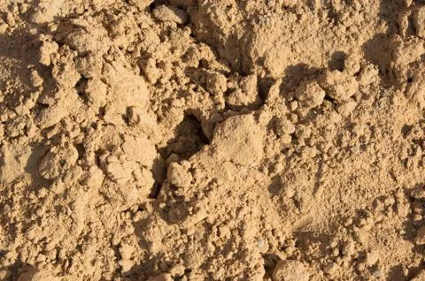 Small slides on the surface of the sand on the beach or in a sandbox Stock Photos