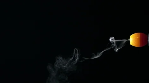 Small smoking candle Stock Footage 101012040