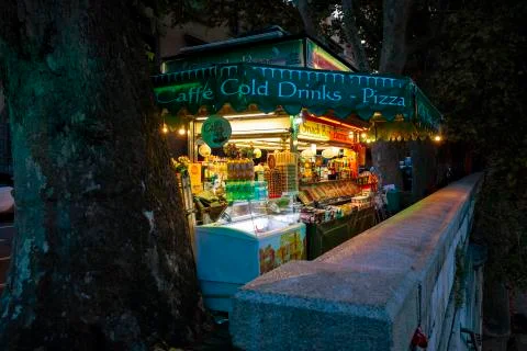A small Snacks Bar  after sunset in Rome Italy. Stock-Fotos