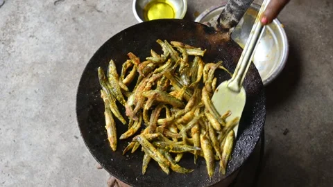 Small Snakehead or Channa orientalis Fish being fried in a pan. Stock Footage 318328345