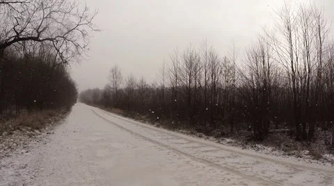 Small Snow-covered Road in The Middle of The Forest Near The Town Stock Footage 59758518