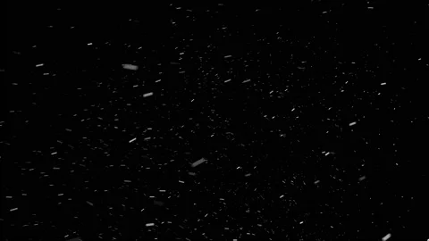 Small snowflakes falling from the sky, isolated on black background. Stock Footage 144129930