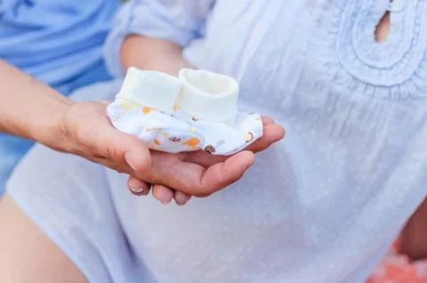 Small socks in hand Stock Photos