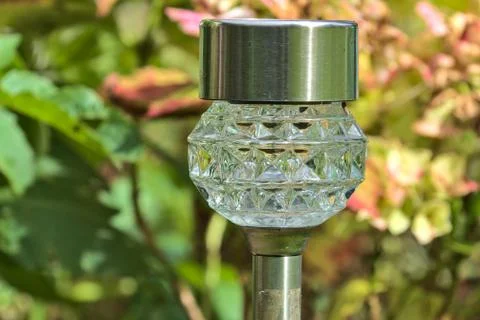 Small solar lantern in the garden Stock Photos