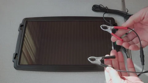 A small solar panel for recharging a car battery. Stock Footage 228824244