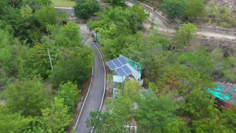 Small Solar-Powered Building on Forest Road in Rajasthan Stock Footage 312365317