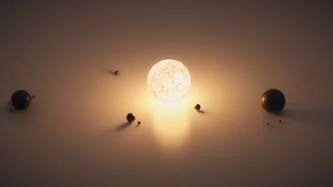 Small solar system on the table. Shining star and planets. Stock Footage 126059349