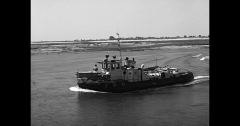 Small Soviet tugboat navigating a wide river, USSR 1960s. Video stock 333205015