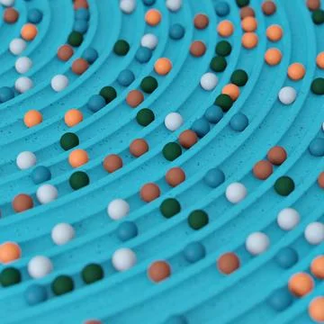 Small spheres rolling down wavy slide Stock Illustration