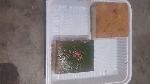 Small sponge cakes with different creams Stock Footage 294168153