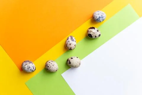 Small spotted quail eggs.Quail eggs pattern. Happy easter concept. Minimal Stock Photos