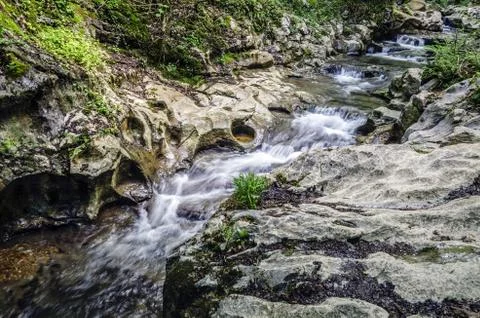 Small spring close to the cave in Navarra's mountain Stock Photos