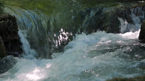A small spring waterfall in the stream Stock-Footage 88481370