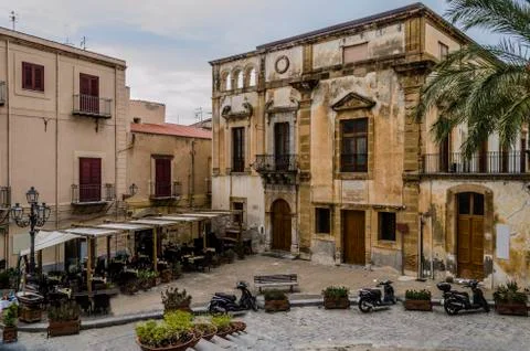 Small square and old constructions in the city of Monreale Stock Photos