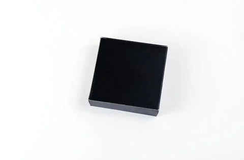 Small Square black gift box on white background. Paper box for wrapping roman Stock Photos