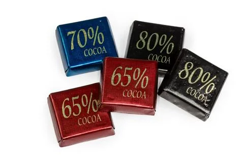 Small square chocolate bars with different percentages of cocoa content Stock Photos