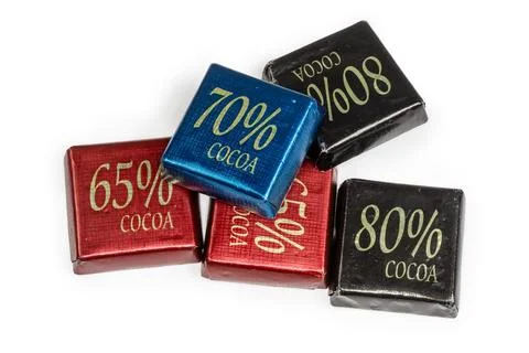 Small square chocolate bars with different percentages of cocoa content Stock Photos