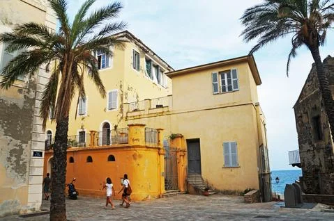 Small square in the old town of Erbalunga, Corsica, France. August 12, 2020. Stock Photos
