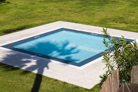 Small square pool with shadow Stock Photos