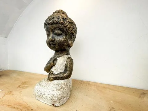 Small statue decorations for table and interior, little buddha statue Stock Photos