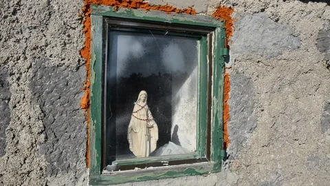 A small statue of the Virgin Mary on a window. Blessed Virgin Mary Mother. Video stock 101437991