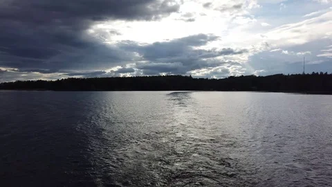 Small stern wave and beautiful lake landscape in the evening Stock-Footage 112146429