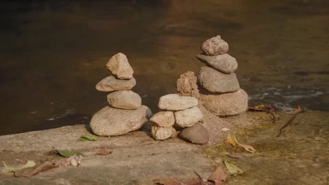 Small Stone Cairn on Rocky River with Flowing Water in Natural Forest Stock Footage 329903718