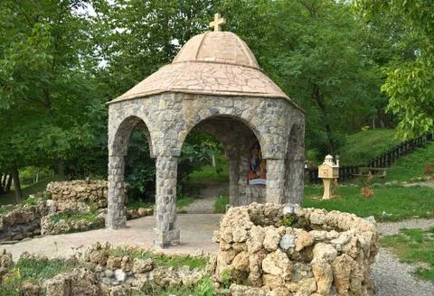 Small stone open chapel with two fountains Stock Photos